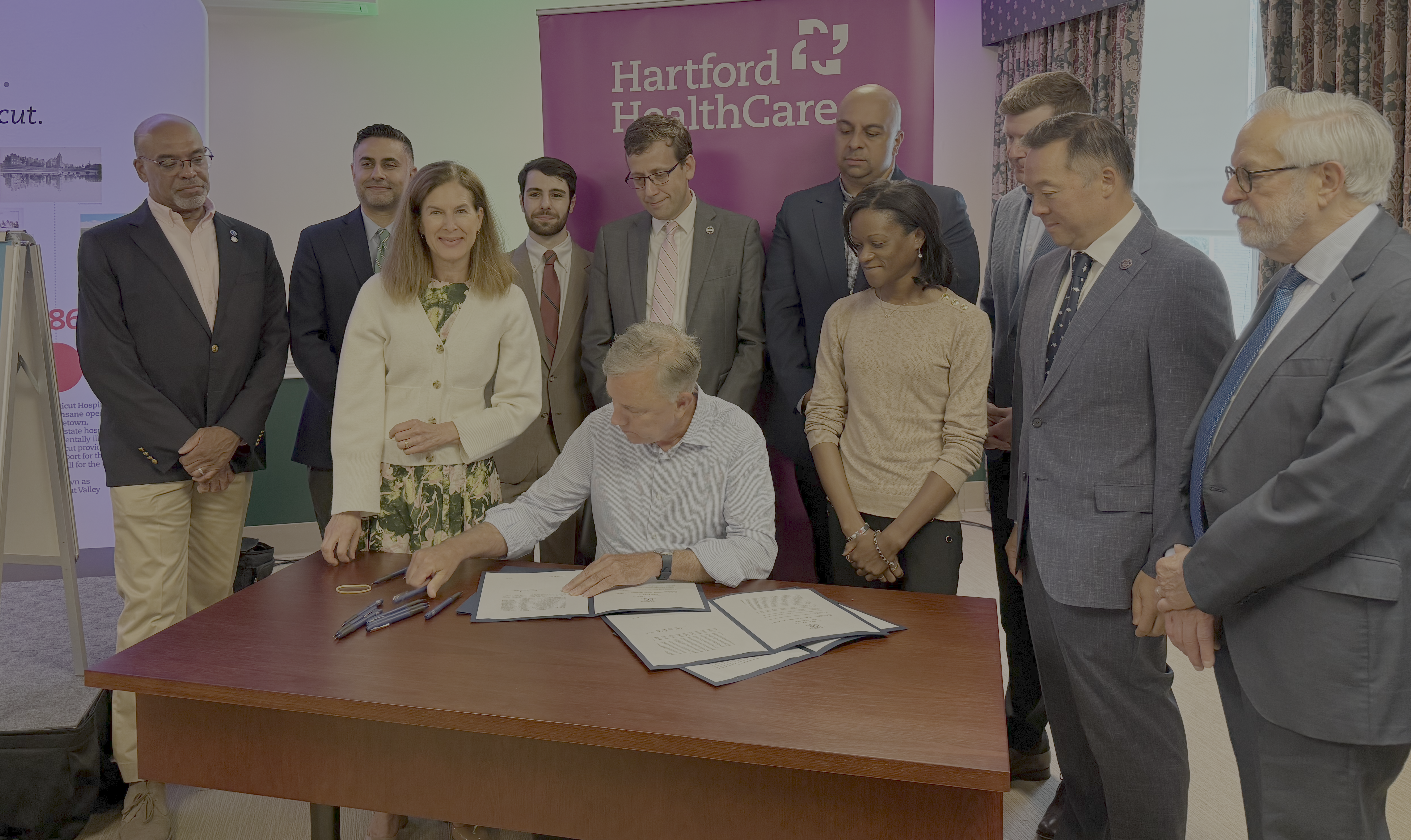 Governor Lamont signing SB 10 alongside Connecticut leaders and advocates.